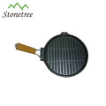 round vegetable oil cast iron skillet with wooden handle